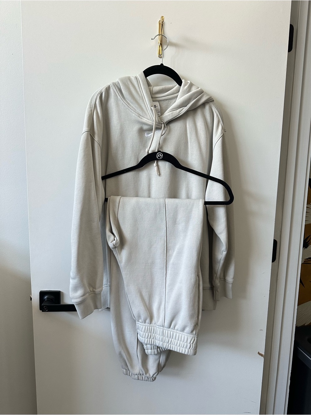 Nike women’s oversized sweat suit in Light Cream